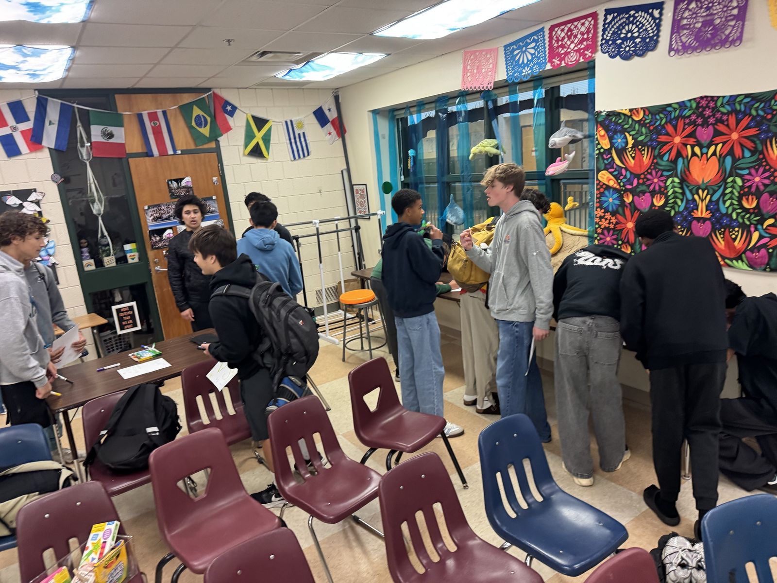 Students making posters around the classroom